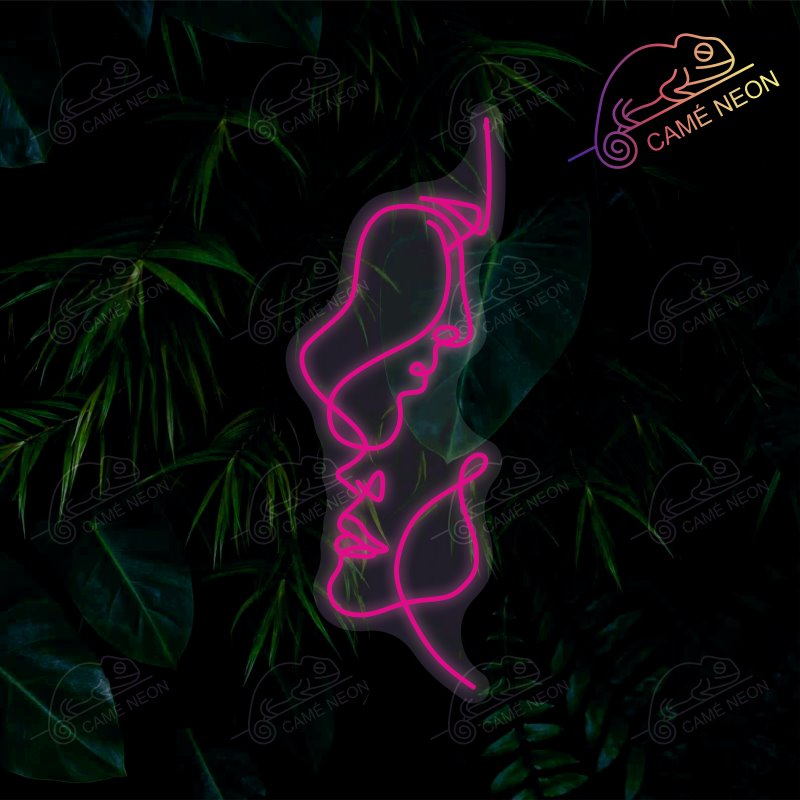 Néon LED Deux Visages lumineux, idéal pour une décoration artistique et élégante dans un salon ou une chambre.