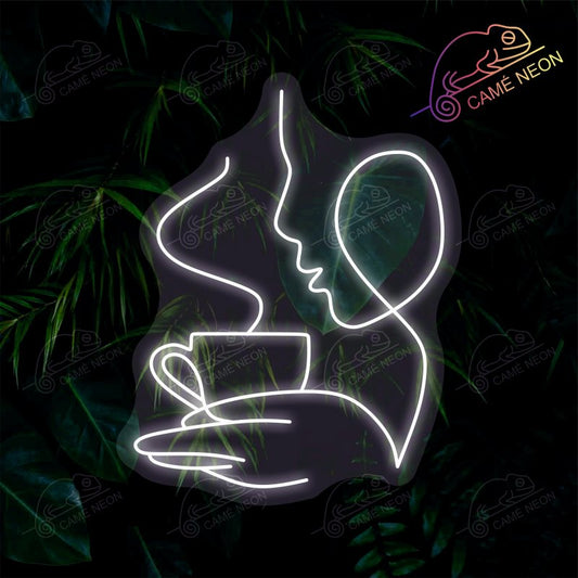 Néon LED représentant une silhouette buvant un café, en jaune lumineux, parfait pour un café ou une cuisine conviviale.