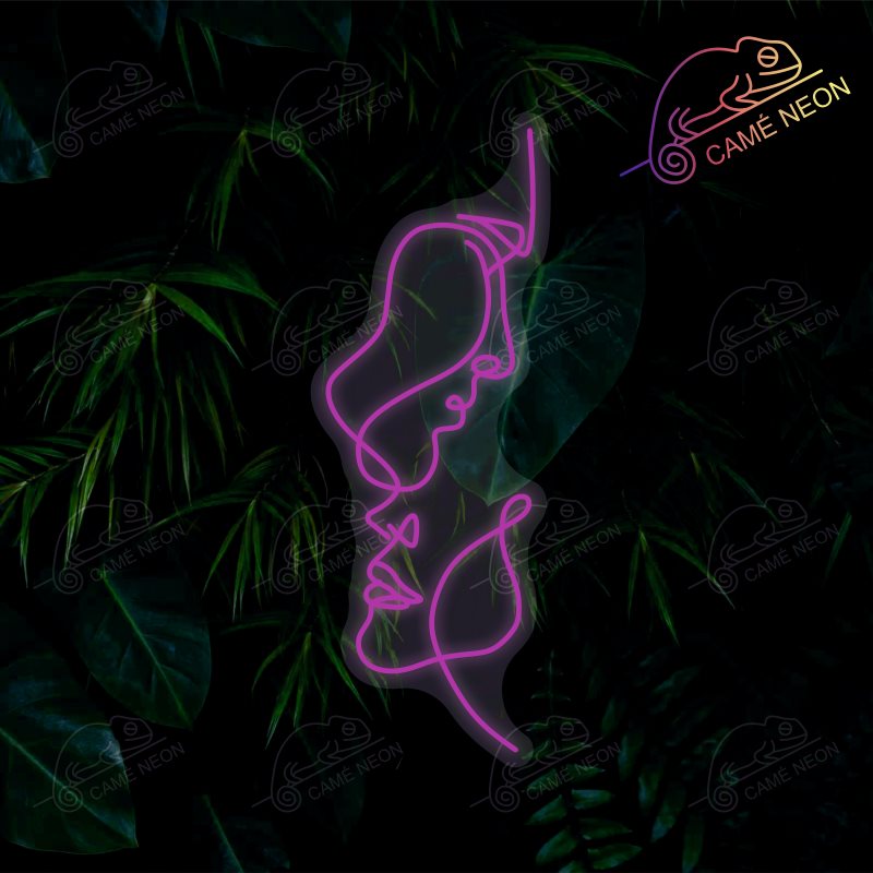 Néon LED Deux Visages lumineux, idéal pour une décoration artistique et élégante dans un salon ou une chambre.